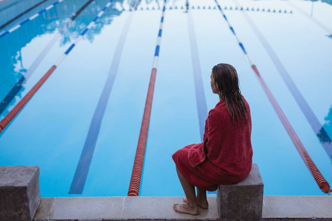 Swimmer sitting in towel
