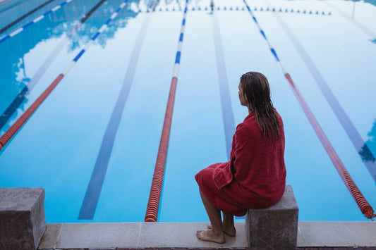 Swimmer sitting in towel