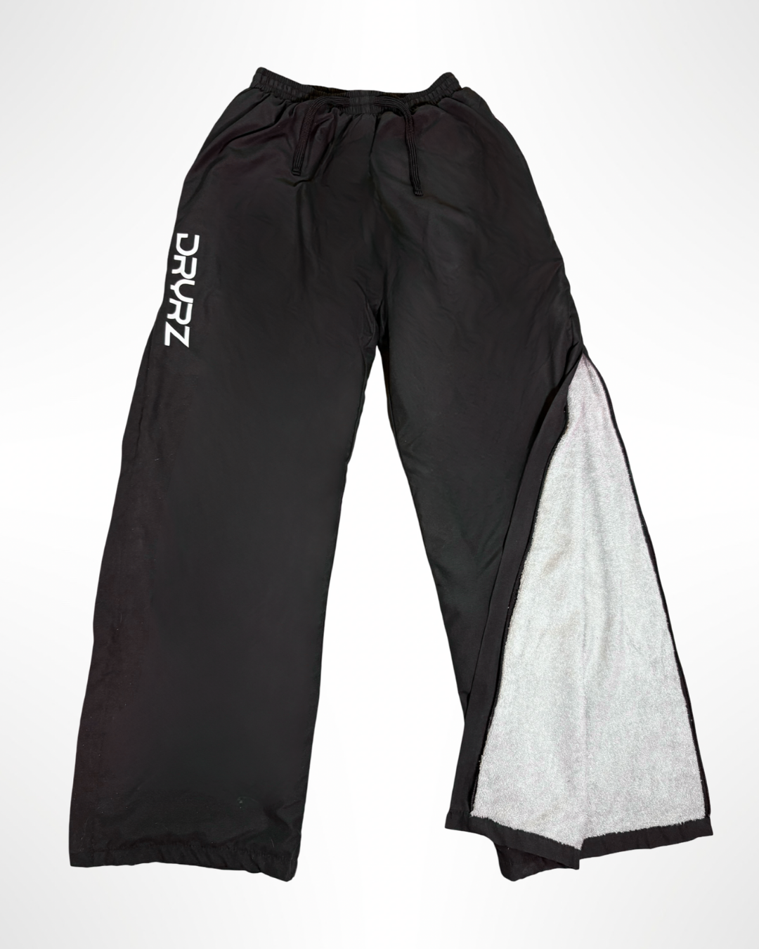 Flat lay front view of DRYRZ BambooLayer thermal trousers, showing logo and design. Detailed fabric close-up of DRYRZ moisture-wicking bamboo-lined recovery joggers, emphasizing soft-touch comfort and post-workout heat retention.
